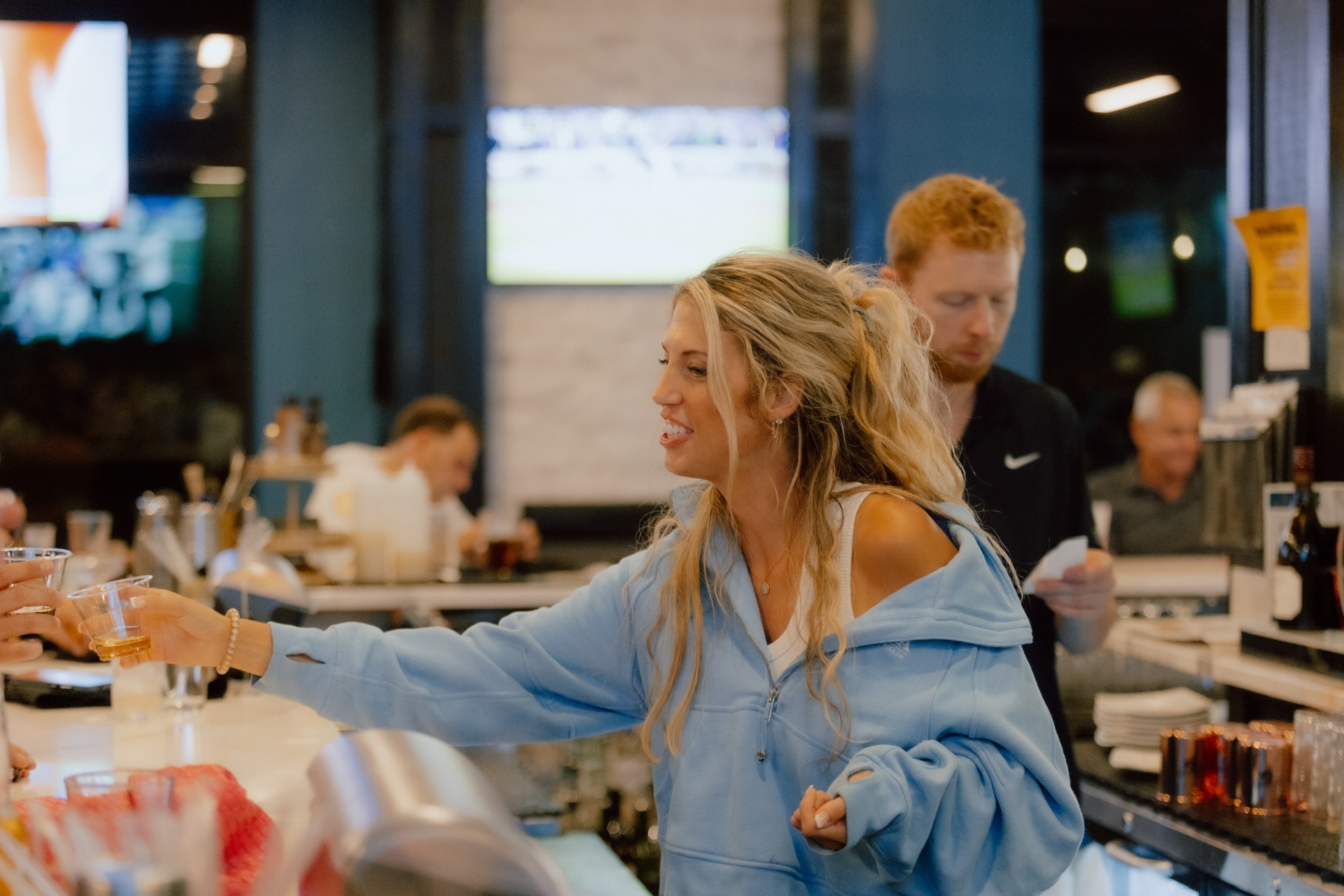 Bartender pouring shots at the bar